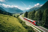 Fototapeta Natura - Freight Train in a Mountain Landscape
