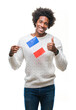 © Krakenimages.com - Afro american man flag of France over isolated background happy with big smile doing ok sign, thumb up with fingers, excellent sign