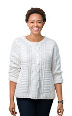 Wall Mural - Beautiful young african american woman wearing sweater over isolated background with a happy and cool smile on face. Lucky person.