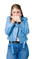 Sticker - Beautiful middle age mature woman wearing fashion leather jacket over isolated background shocked covering mouth with hands for mistake. Secret concept.