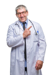 Sticker - Handsome senior doctor man over isolated background cheerful with a smile of face pointing with hand and finger up to the side with happy and natural expression on face looking at the camera.