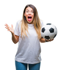 Sticker - Young beautiful woman holding soccer ball over isolated background very happy and excited, winner expression celebrating victory screaming with big smile and raised hands