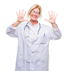 Sticker - Middle age blonde doctor woman over isolated background showing and pointing up with fingers number ten while smiling confident and happy.