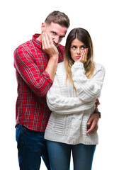 Canvas Print - Young couple in love wearing winter sweater over isolated background thinking looking tired and bored with depression problems with crossed arms.