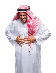 Poster - Young handsome man wearing keffiyeh over isolated background with hand on stomach because indigestion, painful illness feeling unwell. Ache concept.