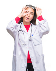 Sticker - Young arab doctor woman over isolated background doing ok gesture shocked with surprised face, eye looking through fingers. Unbelieving expression.