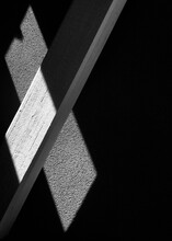 Monochrome Photo Of Light On A Piece Of Wood In The Dark