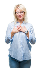 Poster - Young beautiful blonde business woman wearing glasses over isolated background smiling with hands on chest with closed eyes and grateful gesture on face. Health concept.