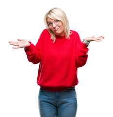 Poster - Young beautiful blonde woman wearing sweater and glasses over isolated background clueless and confused expression with arms and hands raised. Doubt concept.