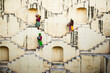 Three ladies holding pots at Khun Meena Pamid Stepwell, Rajasthan, India