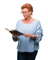 Canvas Print - Senior caucasian woman reading a book over isolated background with a confident expression on smart face thinking serious