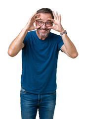 Canvas Print - Handsome middle age hoary senior man wearin glasses over isolated background Trying to open eyes with fingers, sleepy and tired for morning fatigue