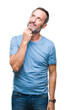 © Krakenimages.com - Middle age hoary senior man over isolated background with hand on chin thinking about question, pensive expression. Smiling with thoughtful face. Doubt concept.