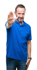 Poster - Middle age hoary senior man over isolated background doing stop sing with palm of the hand. Warning expression with negative and serious gesture on the face.