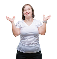 Wall Mural - Young adult woman with down syndrome over isolated background crazy and mad shouting and yelling with aggressive expression and arms raised. Frustration concept.