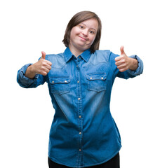 Poster - Young adult woman with down syndrome over isolated background success sign doing positive gesture with hand, thumbs up smiling and happy. Looking at the camera with cheerful expression