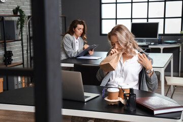 Poster - Young woman with paper bag having panic attack in office