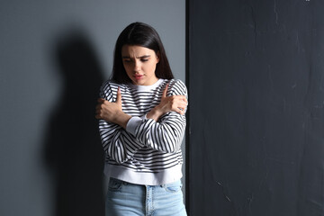 Wall Mural - Young woman having panic attack indoors