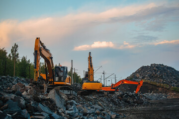 Wall Mural - Excavators working on earthmoving at open pit mine in mining and processing plant