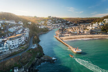 Aerial View Of Looe Harbour And Banjo Pier With Looe River And Town, Cornwall, United Kingdom.
