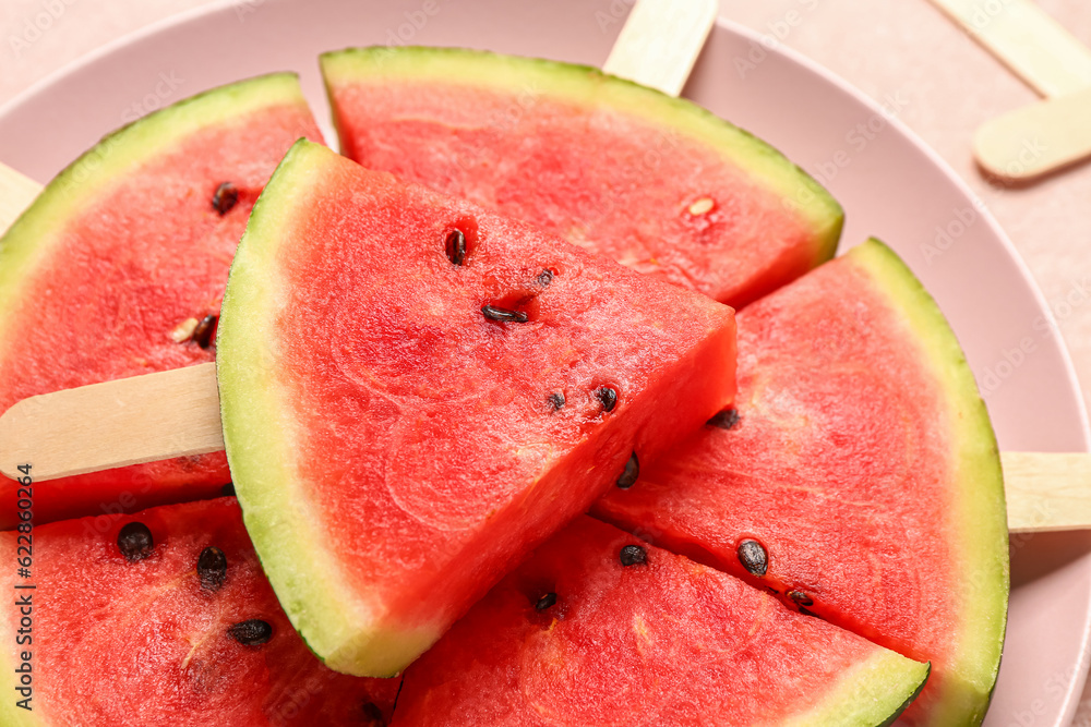 Plate with sweet watermelon sticks, closeup