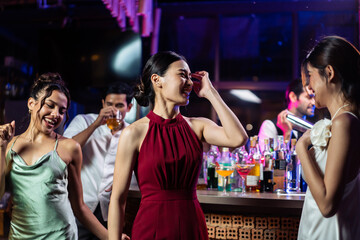 Asian beautiful women having fun, meeting each other in bar restaurant. 