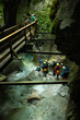 Group of people canyoning in the Seisenkergklamm gorge at Weissbach bei Lofer in Austria