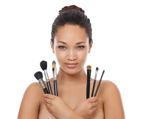 Woman, makeup and portrait of brush set for face, cosmetics or aesthetic tools isolated on transparent png background. Young female model, facial beauty and holding collection of skincare products