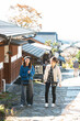 © amanaimages - 秋の宿場町を散策する女性２人