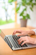 © amanaimages - ノートブックパソコンを操作する両手