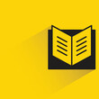 © bigpa - open book with shadow on yellow background
