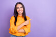 © deagreez - Photo of young promoter big ads company girl wear orange shirt looking point finger empty space pricelist isolated on purple color background