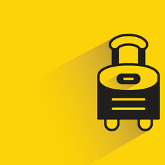 luggage bag with shadow on yellow background