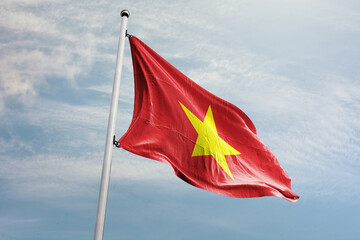 Wall Mural - The flag of Vietnam features a yellow five-pointed star on a red background. The flag is a symbol of the country's struggle against domination by the French and communist leadership