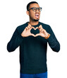 © Krakenimages.com - Young african american man doing heart symbol with hands angry and mad screaming frustrated and furious, shouting with anger. rage and aggressive concept.