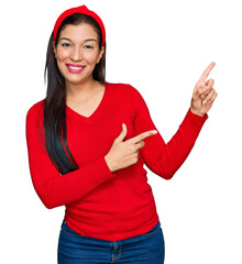 Poster - Young hispanic woman wearing casual clothes smiling and looking at the camera pointing with two hands and fingers to the side.