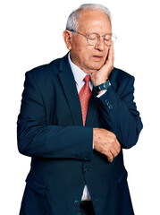 Wall Mural - Senior man with grey hair wearing business suit and glasses thinking looking tired and bored with depression problems with crossed arms.