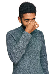 Sticker - Young african american man wearing casual clothes tired rubbing nose and eyes feeling fatigue and headache. stress and frustration concept.