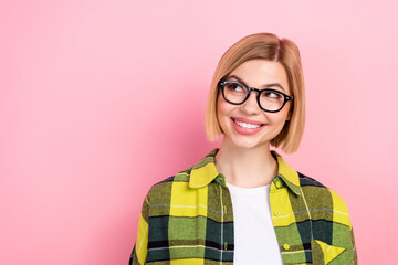 Photo portrait of pretty young girl specs look empty space smile dressed stylish checkered yellow outfit isolated on pink color background