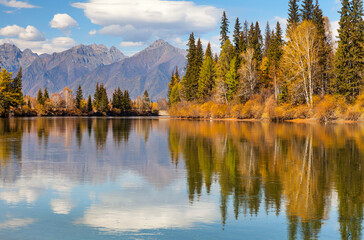 Wall Mural - scenic autumn landscape with the eastern sayan mountains and yellowed trees on the banks of the irku