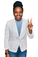 Canvas Print - Young african american woman wearing business clothes showing and pointing up with fingers number two while smiling confident and happy.