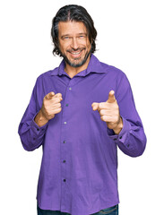 Poster - Middle age handsome man wearing business shirt pointing fingers to camera with happy and funny face. good energy and vibes.