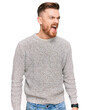 © Krakenimages.com - Young redhead man wearing casual winter sweater angry and mad screaming frustrated and furious, shouting with anger. rage and aggressive concept.