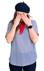 Poster - Young beautiful blonde woman wearing french beret and striped t-shirt rubbing eyes for fatigue and headache, sleepy and tired expression. vision problem