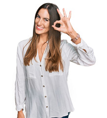 Canvas Print - Young beautiful woman wearing casual clothes smiling positive doing ok sign with hand and fingers. successful expression.