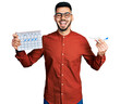 © Krakenimages.com - Young hispanic man with beard holding plane toy and travel calendar smiling and laughing hard out loud because funny crazy joke.