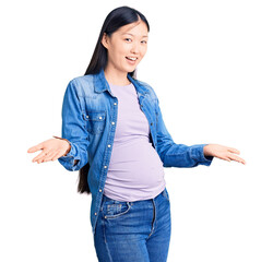 Sticker - Young beautiful chinese woman pregnant expecting baby smiling cheerful offering hands giving assistance and acceptance.