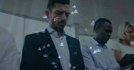 Poster - Animation of network of connections with icons over diverse business people in office