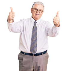 Canvas Print - Senior grey-haired man wearing business clothes approving doing positive gesture with hand, thumbs up smiling and happy for success. winner gesture.