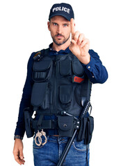 Poster - Young handsome man wearing police uniform pointing with finger up and angry expression, showing no gesture